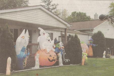 Ghosts and ghouls greet visitors outside the Meister House.